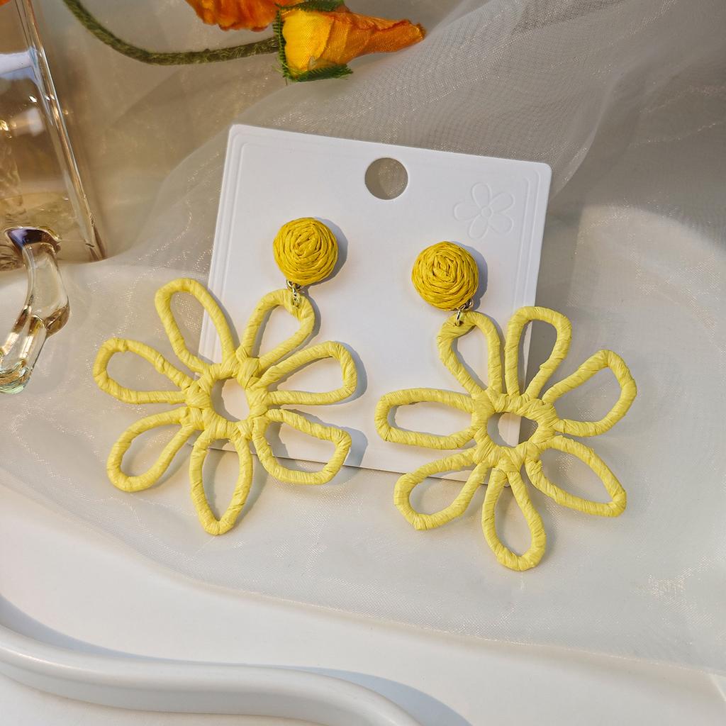 European and American cross-border summer vacation style earrings women, personalized color hand-woven raffia hollow flower earrings