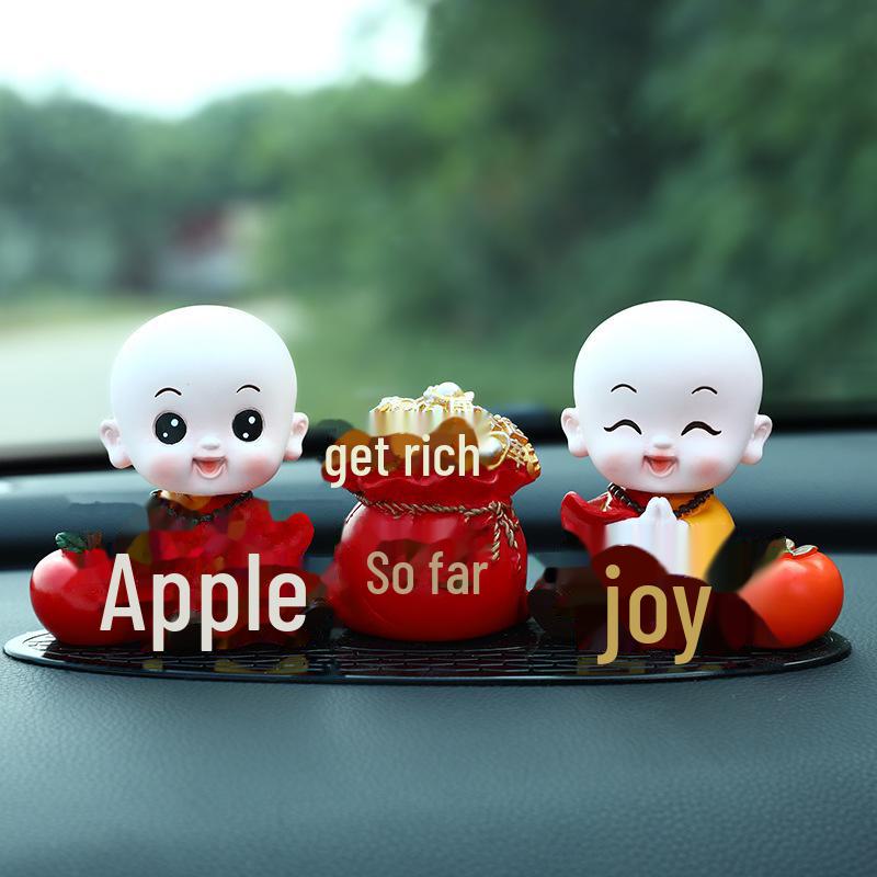 Creative Little Monk Maitreya Buddha Car Ornament: Cute, Shaking Head Resin Doll for Car Interior Decoration and Safety.