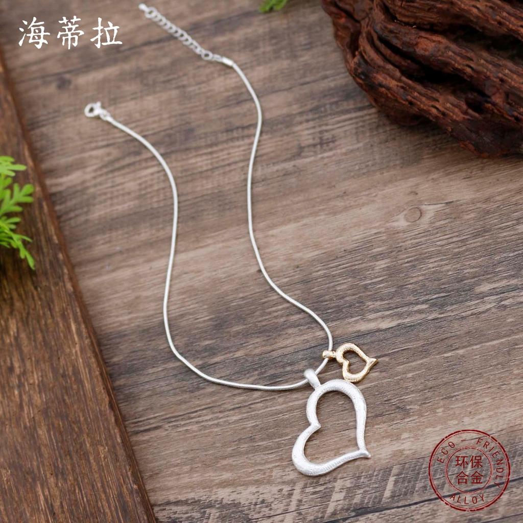 Nowy głupi kolor pusty wisiorek miłosny, damski prosty i zaawansowany zmysł głupie złoto głupie srebro w kształcie serca wszechstronny naszyjnik