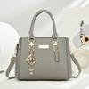 Simple and large-capacity hot-selling handheld women's bags 2026 new fashionable and versatile PU material single shoulder oblique span small