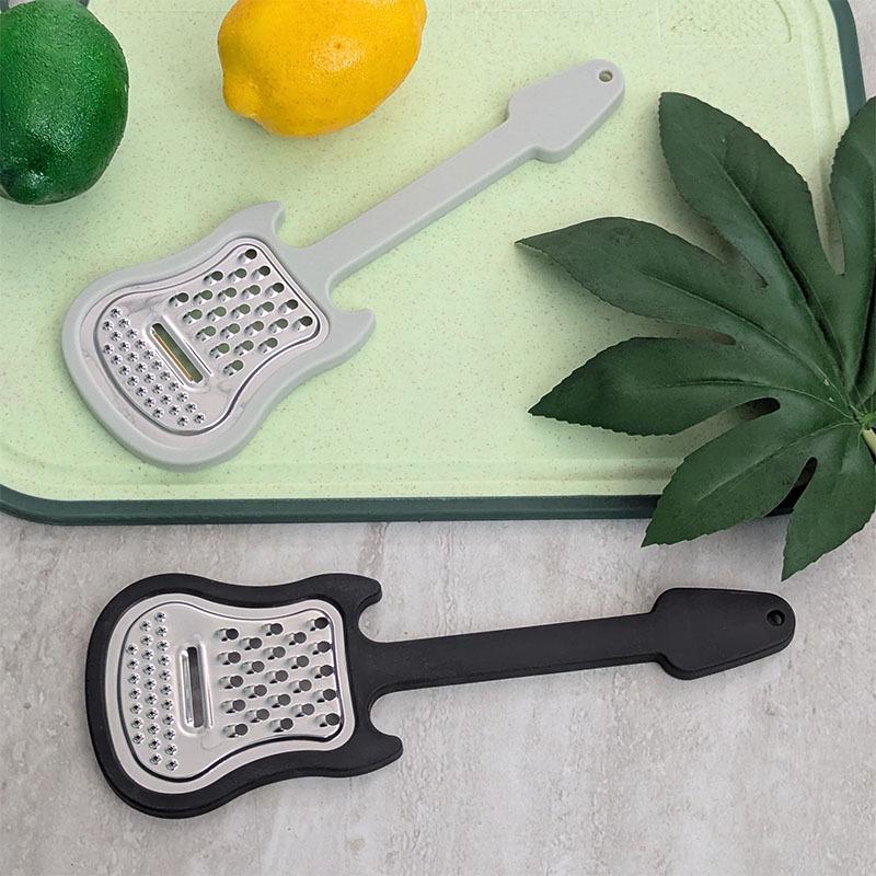 

Multifunctional Stainless Steel Guitar-Shaped Peeler Creative Vegetable, Potato, and Cheese Grater Kitchen Tool--- чорний