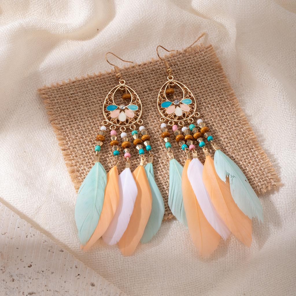 Retro ethnic style woven feathers long fringed earrings, bohemian high-end hollow rice bead earrings