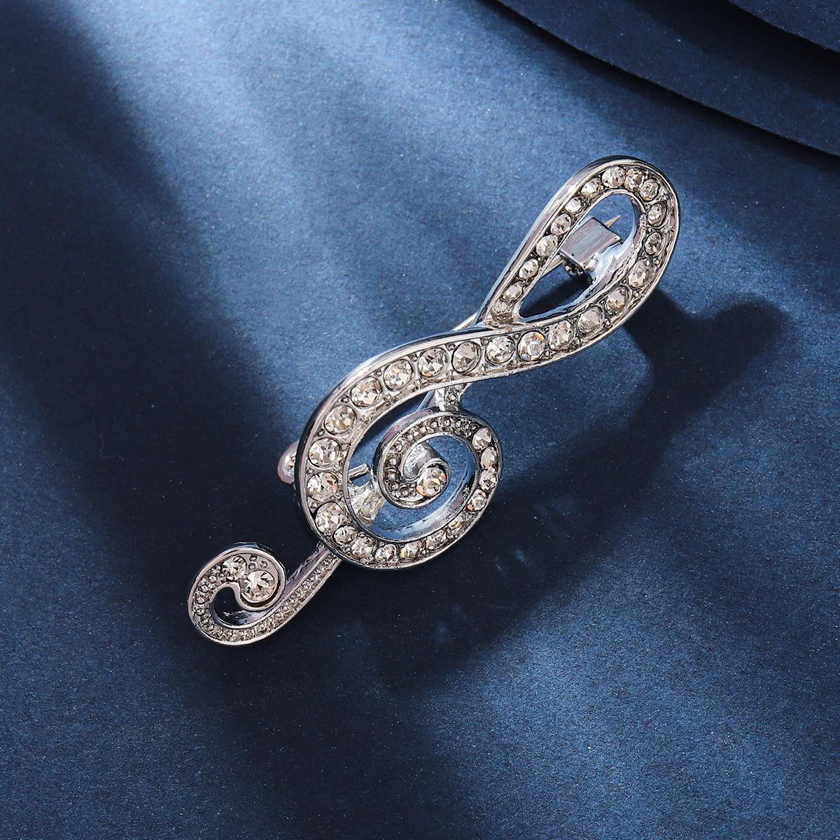 

Электронная коммерция Брошь в виде ноты из сплава с бриллиантами для мужчин и женщин, булавка для корсажа, одежда