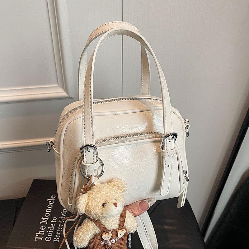 Spring and Summer New Korean Niche Ins Wind Oil Wax Leather Portable Pillow Bag Casual Versatile Commuter Wind Messenger Women's Bag