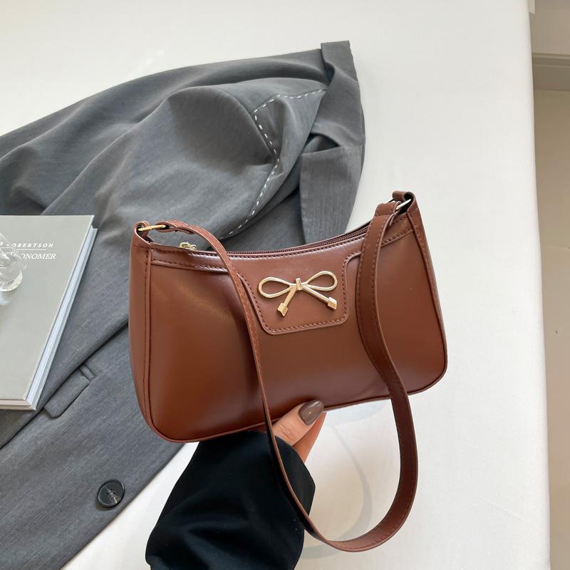 Fashion bow 2025 solid color new Korean version trendy texture foreign style commuting single shoulder underarm baguette bag women