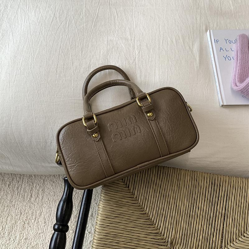 

This year s simple and popular small bag women s 2025 autumn new retro shoulder messenger bag women s portable pillow bag
