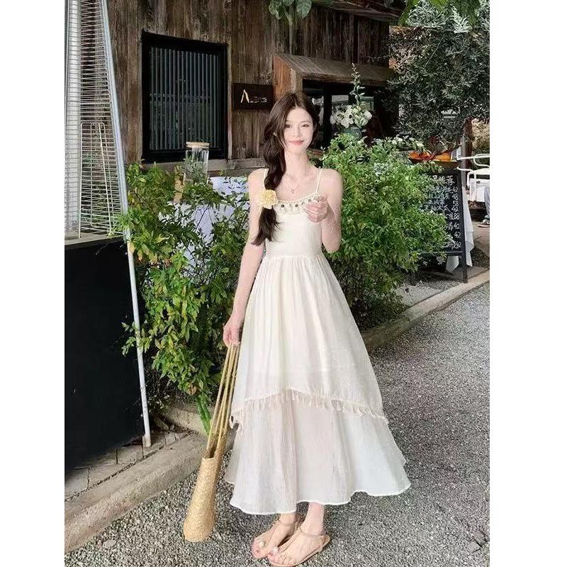 Holiday Wind Fringe Splicing Suspender Dress Women's Summer 2026 New Waist Irregular Gentle First Love Long Dress