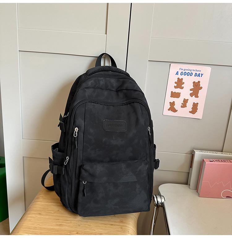 School bag Female and male primary school students Large capacity backpack Junior high school students High school students Lightweight