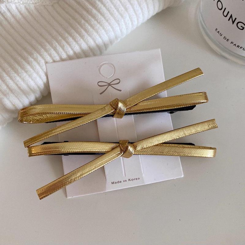 

Южнокорейская серебряная кожаная заколка-бантик: Стиль ретро-минималистичности для женщин.