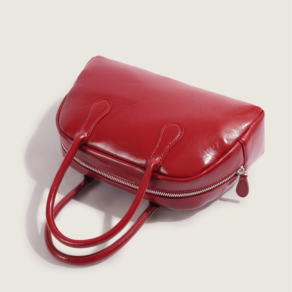 2025 Neue Koreanische Dongdaemun Nischen Handgehaltene Kissen Tasche für Damen Einfache Textur Pendler Handgehaltene Boston Tasche