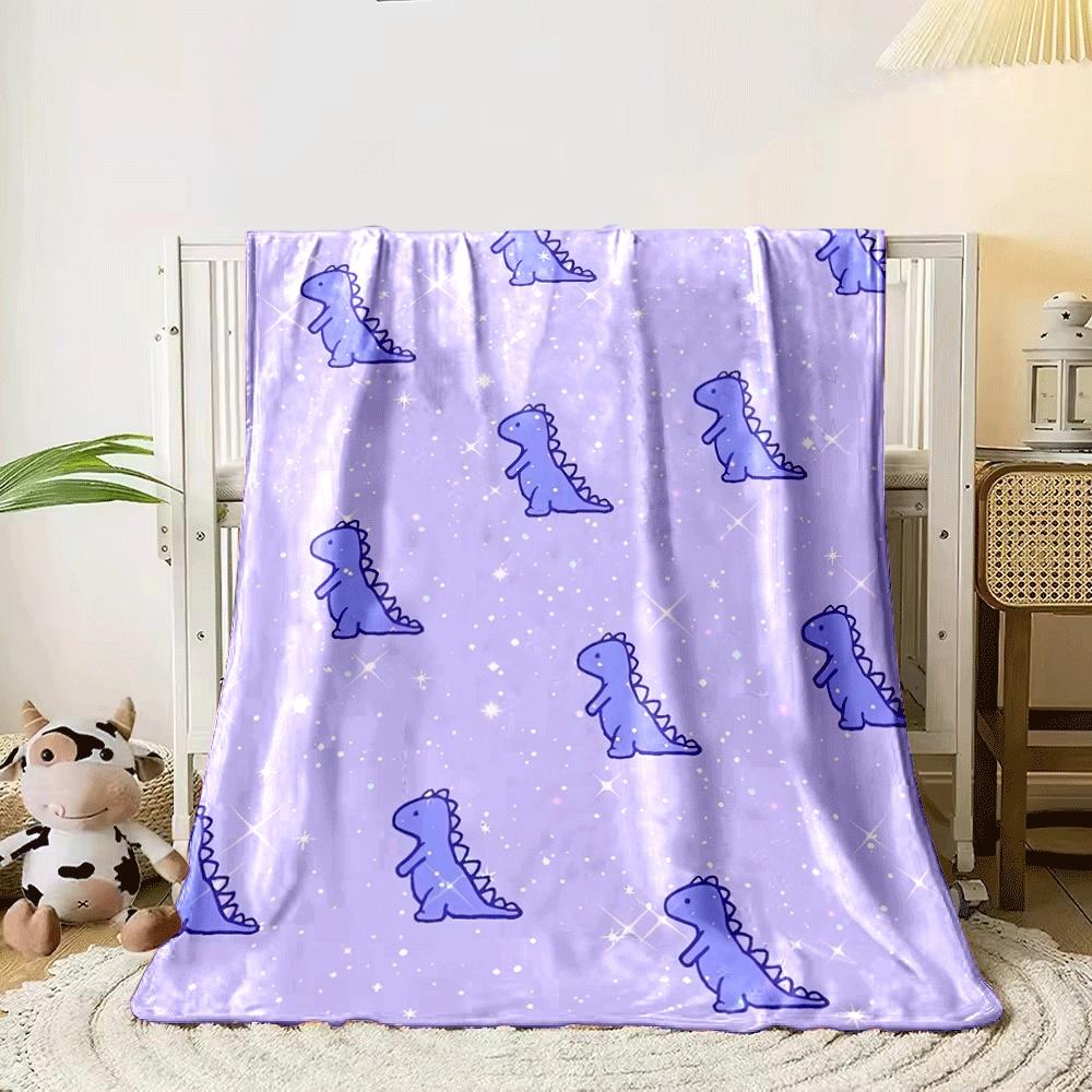 Cute purple dinosaurs scattered on a sparkly, pastel purple background. for all seasons blanket lunch break throw gift 80cm x 120cm