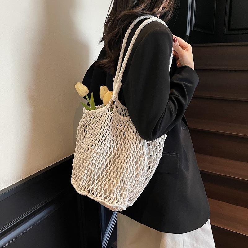 Borsa estiva in maglia traforata di nicchia da donna a grande capacità 2025 nuova borsa tote intrecciata borsa da spiaggia per le vacanze moda