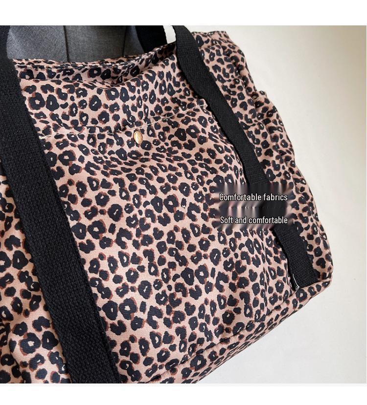 Leopard Print Canvas Tote: Large Capacity Autumn Shoulder Bag for Women, Versatile for College and Commute.