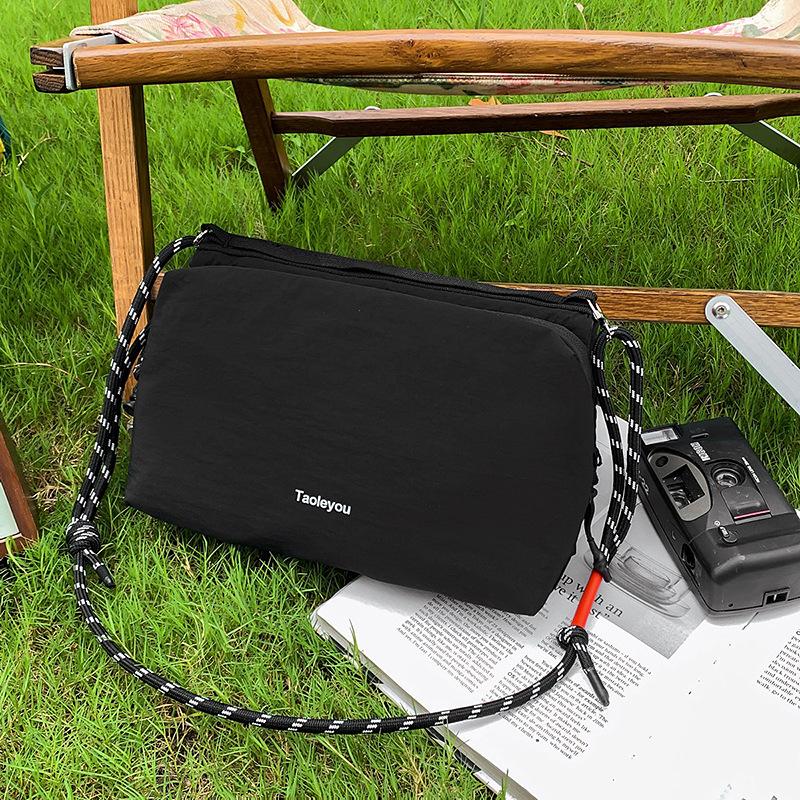 Mountain outdoor leisure messenger bag men's tide brand lightweight waterproof shoulder bag large capacity commuter backpack women's mobile phone bag