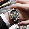 Brand trend fashion waterproof luminous business automatic quartz relief hollow men's watch