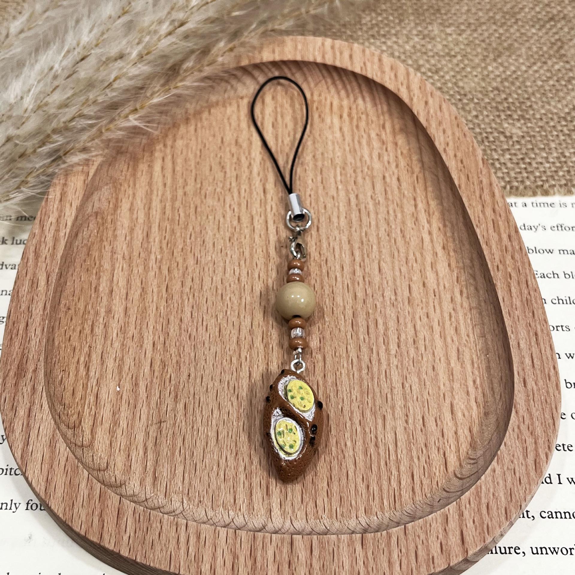 Xiaohongshu Bestseller: Dark Bread Food Toy Keychain with Cute Pendant and Lanyard 1