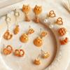 Fun & Cute Caramel Bread Drip Oil Geometric Stud Earrings: Cartoon Niche Light Luxury Accessories