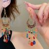 Bohemian ethnic style fringed earrings long niche woven feather earrings new travel wear earrings women