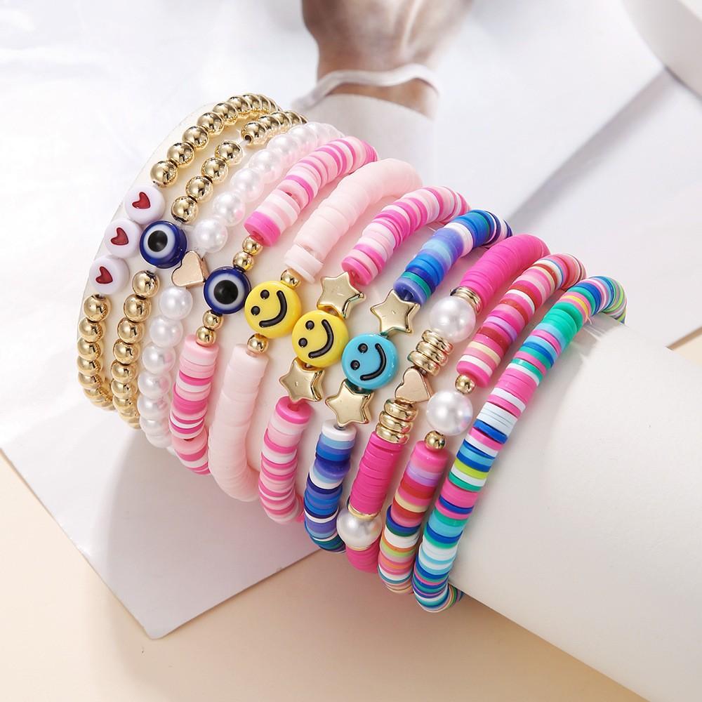 Korean version of fashion new multi-layer elastic thread soft pottery love smiley face bracelet set retro handmade pearl jewelry women
