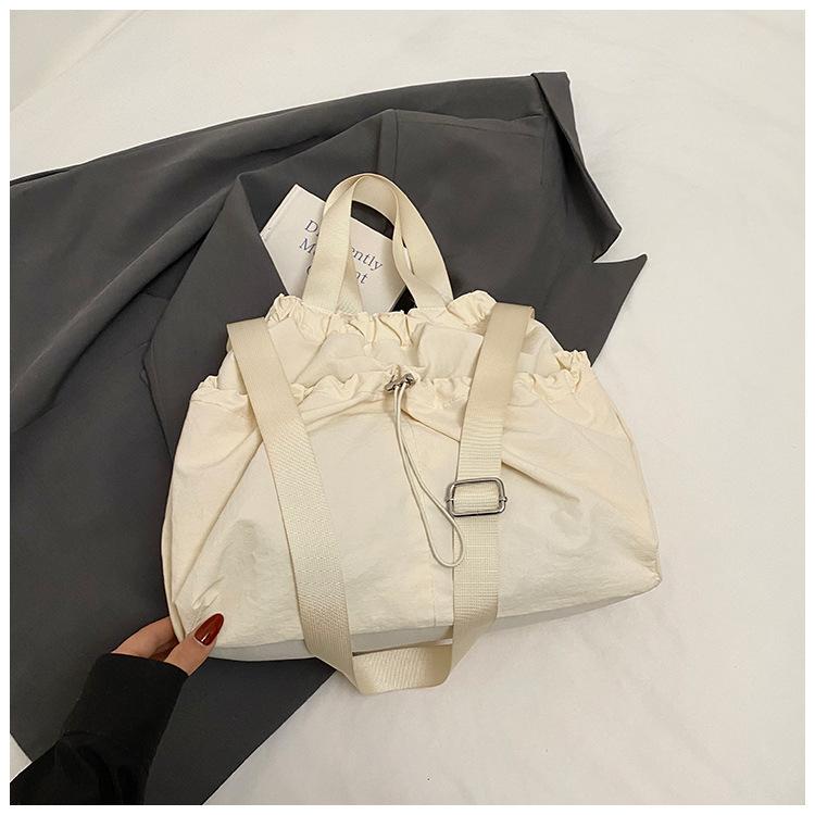 

2025 Japanese Hansen Lazy Wind Canvas Bag Women s Large Capacity Drawstring Handbag High Value College Student Class Bag