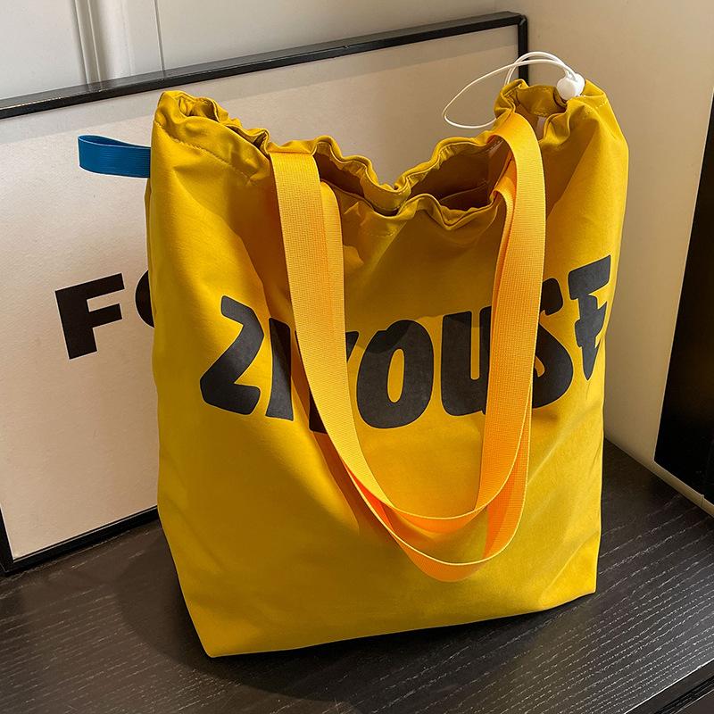 

Nylon cloth bag women s 2024 new autumn and winter bucket bag large-capacity versatile, popular shoulder bag tote bag this year жовтий