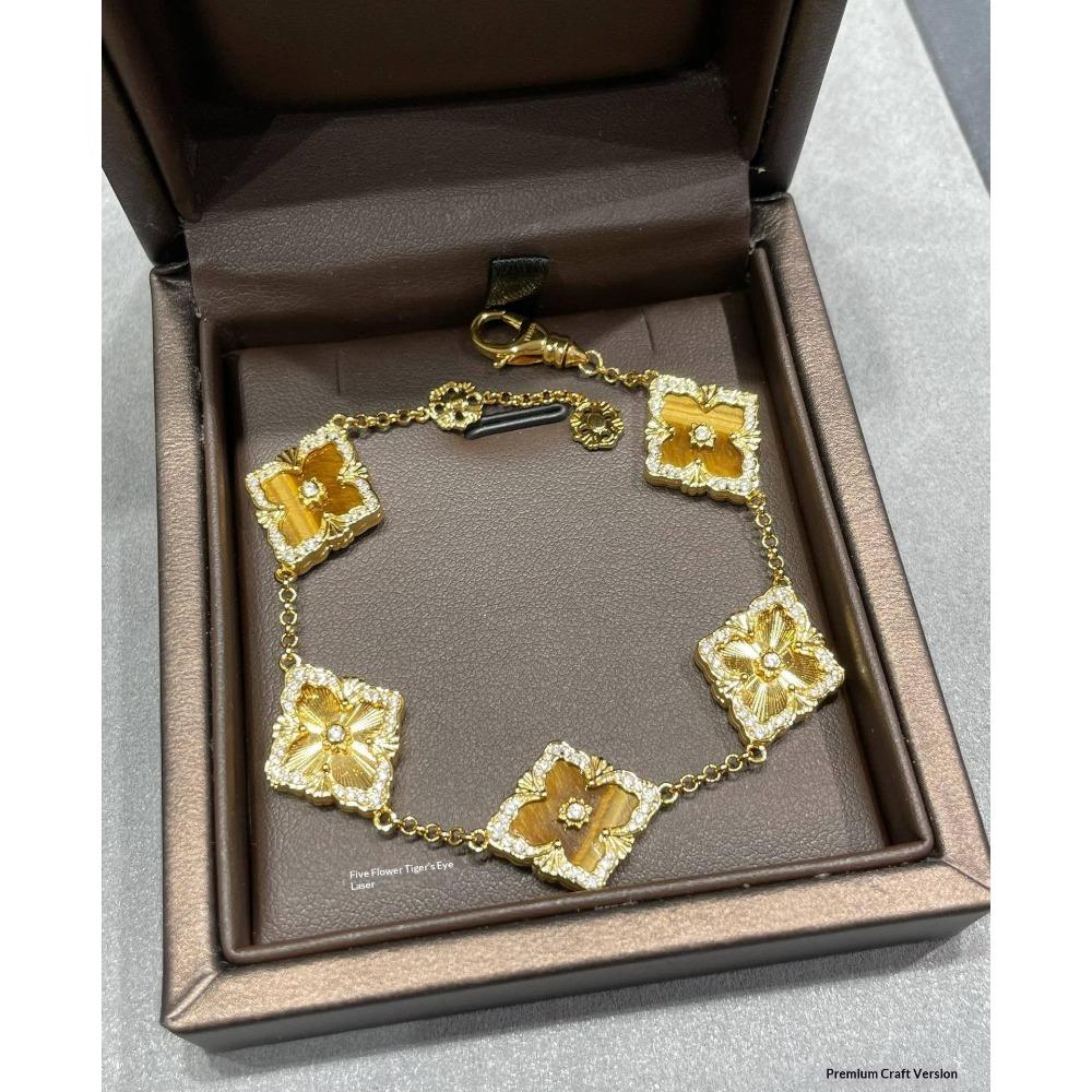 Pulsera de trébol de cuatro hojas para mujer, estilo palacio retro, lujo accesible, moda elegante.