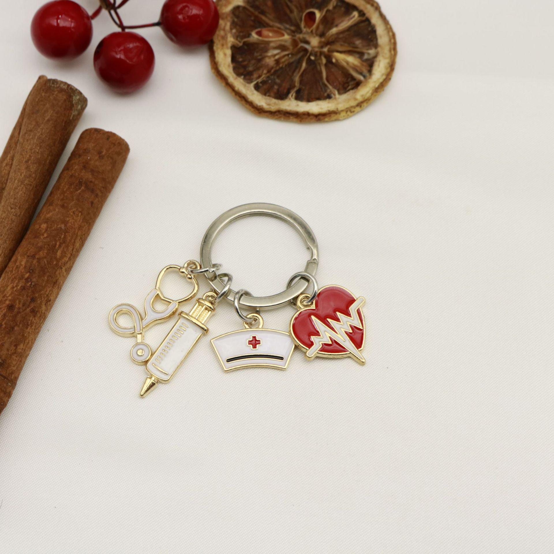 Doctor & Nurse Keychain with Cap, Syringe, Stethoscope & Heartbeat Charms серебряный