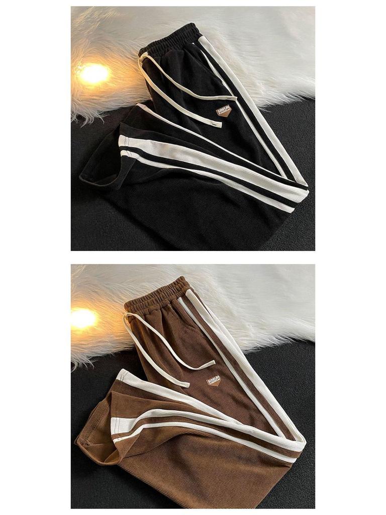 Męskie spodnie dresowe w paski w stylu retro: Luźne, amerykańskie spodnie z szerokimi nogawkami, proste i dopasowane, idealne na jesień