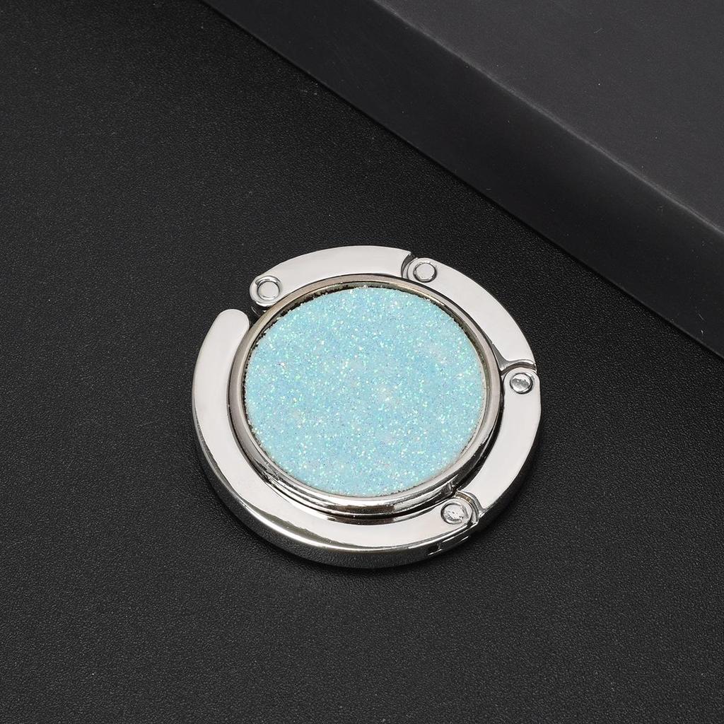 Kulatý skládací háček na kabelku – Přenosný kreativní věšák na batoh na okraj stolu.