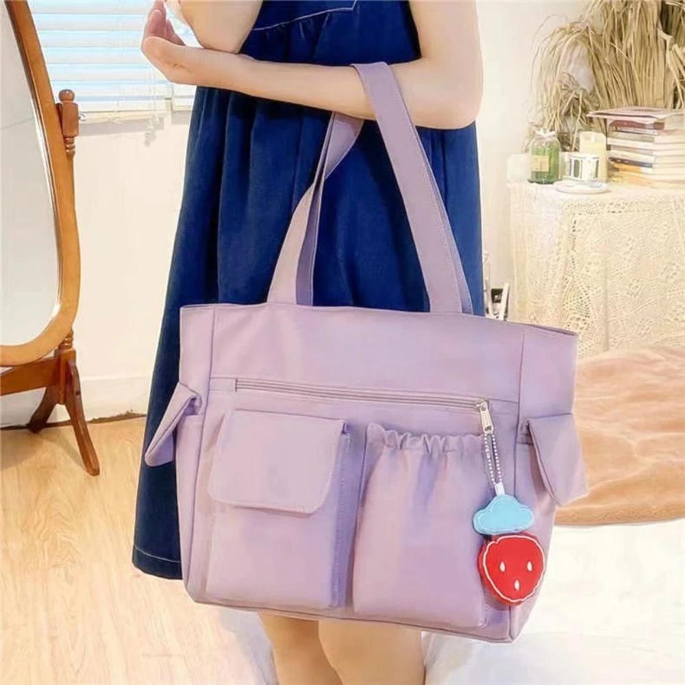 

New Solid Color Simple Versatile Bag Strawberry Pendant Cute Hand Bag College Students Commuting Shoulder Bags Large Capacit лавандовий