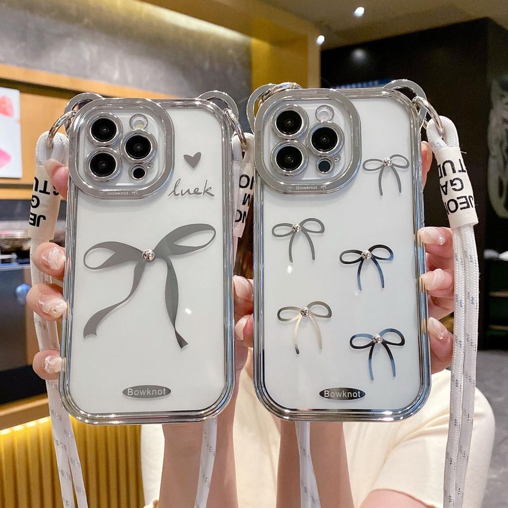 The Bow Tie Crossbody Lanyard Is Suitable for IPhone15promax Phone Cases. It Features A Simple Apple 14 Electroplated Anti-drop Soft Case