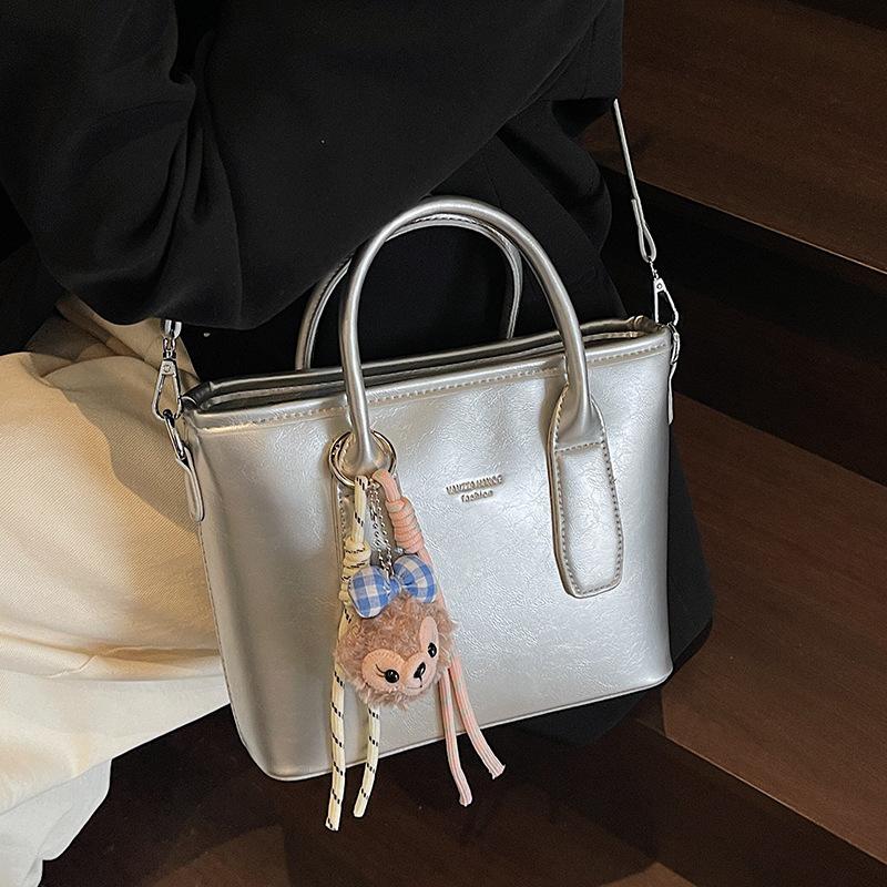 New High-end Korean Version Hugh Simple Portable Bucket Bag Versatile Commuter Fashion Niche Messenger Bag Bag Woman