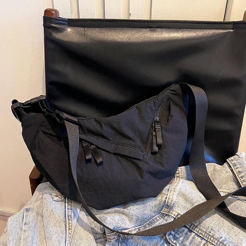 Retro casual dumpling bag new nylon fashion trend line portable shoulder messenger women's bag