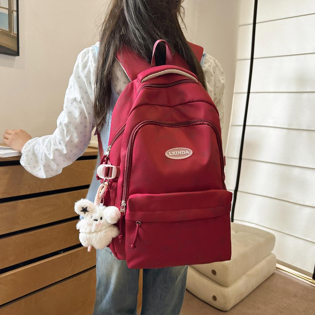 Schoolbag Large capacity schoolbag for men and women, junior high school students, campus solid color backpack, Japanese versatile college student