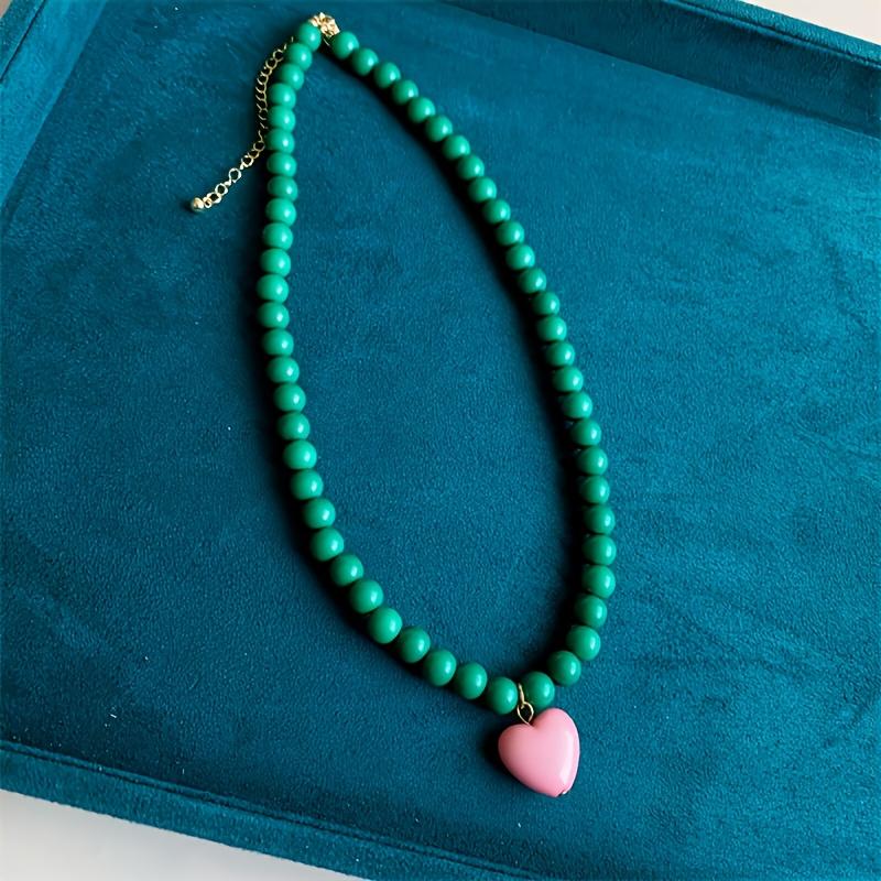 A Trendy New Colorful Bead Necklace Featuring a Unique Heart-Shaped Pendant, Perfect for Women Who Love Fashionable Handmade