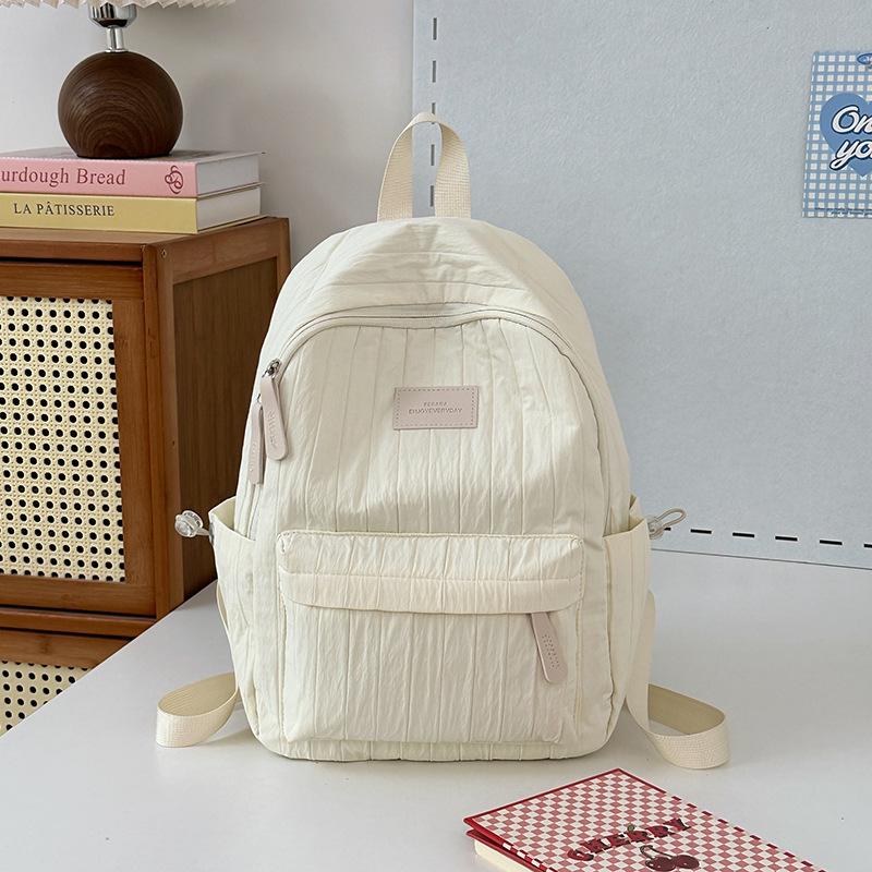 School bag junior high school girls large capacity solid color light primary school backpack high value girl versatile backpack