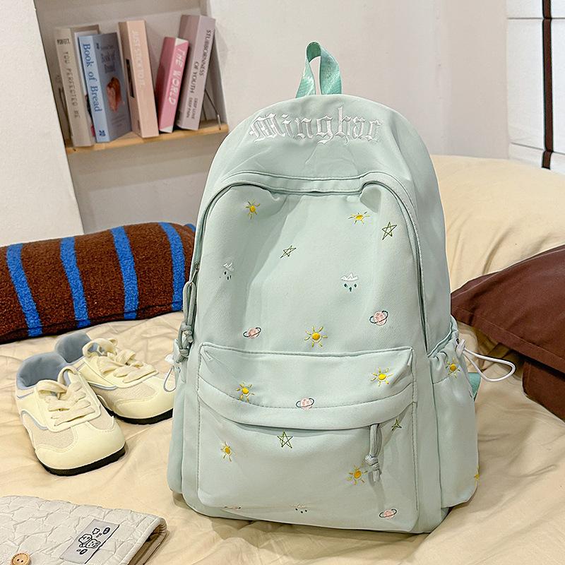 Design sense dopamine embroidery large capacity junior high school bag ins niche female high school student lightweight backpack