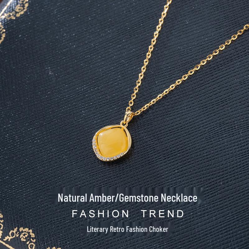 Amber Pendant Necklace with S925 Silver - Retro Water Drop Design with Light Luxury Gemstone.