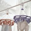 Portable Round Clothes Drying Rack With Multiple Clips Ideal For Indoor Use