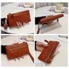 Litchi pattern lady holding wallet