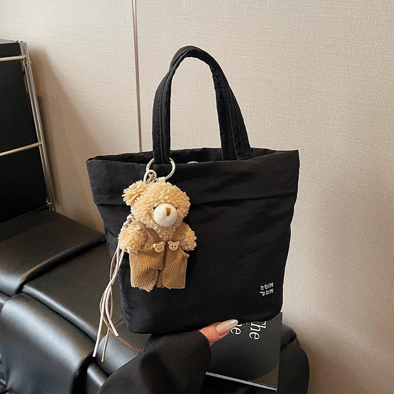 

Нишевый дизайн портативная сумка-тоут женская новая модная повседневная простая сумка через плечо для通勤 холщовая сумка-мессенджер