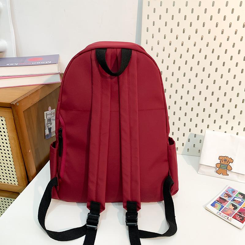 School bag new fashion solid color large capacity school bag Korean version ins versatile simple backpack casual spring outing light backpack