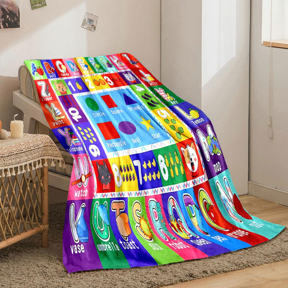 The pattern consists of letters, numbers, shapes, and corresponding images. for all seasons blanket lunch break throw gift