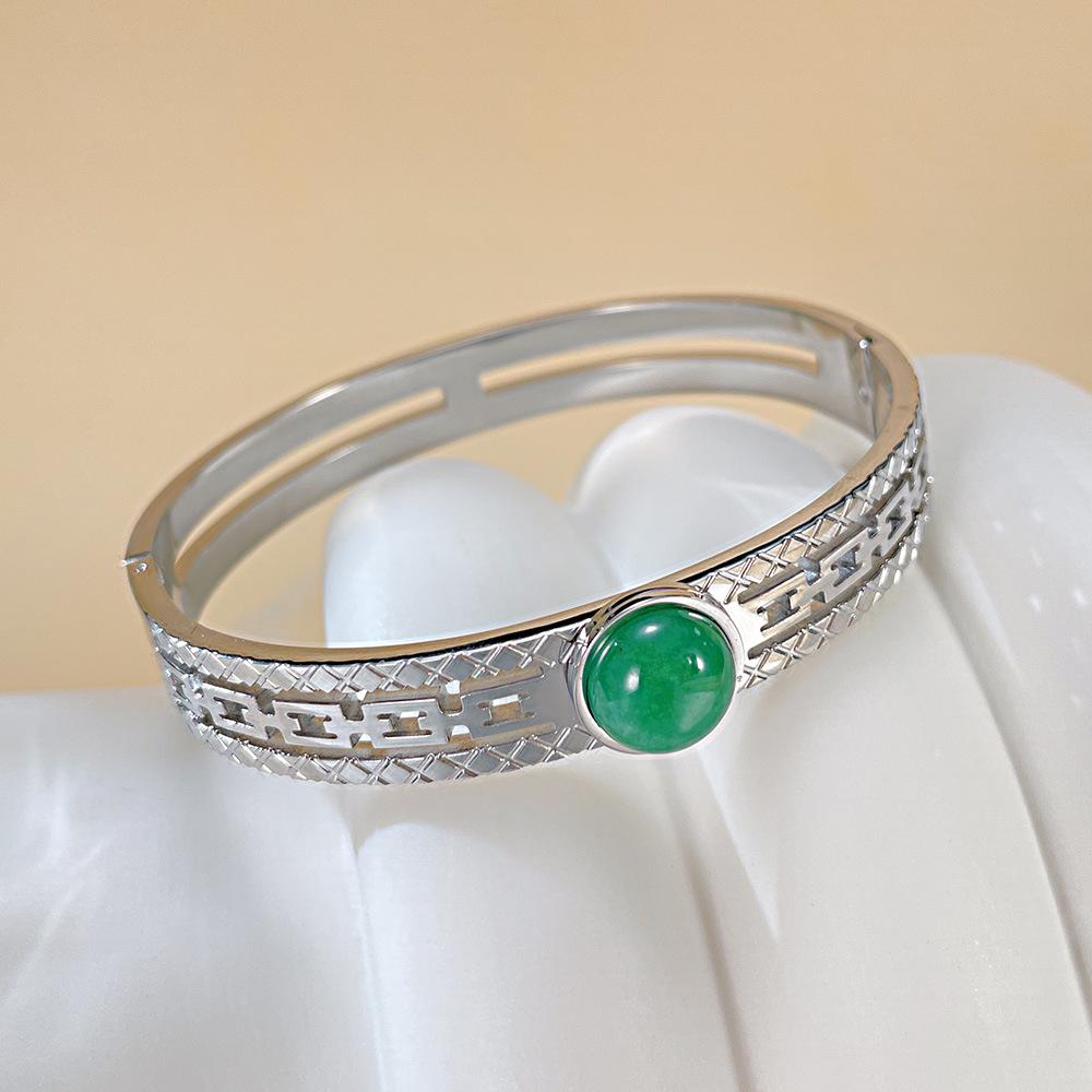 Elegant Titanium Steel Women's Hollow Bangle: European-American Fashion, Light Luxury, and Versatile Accessory