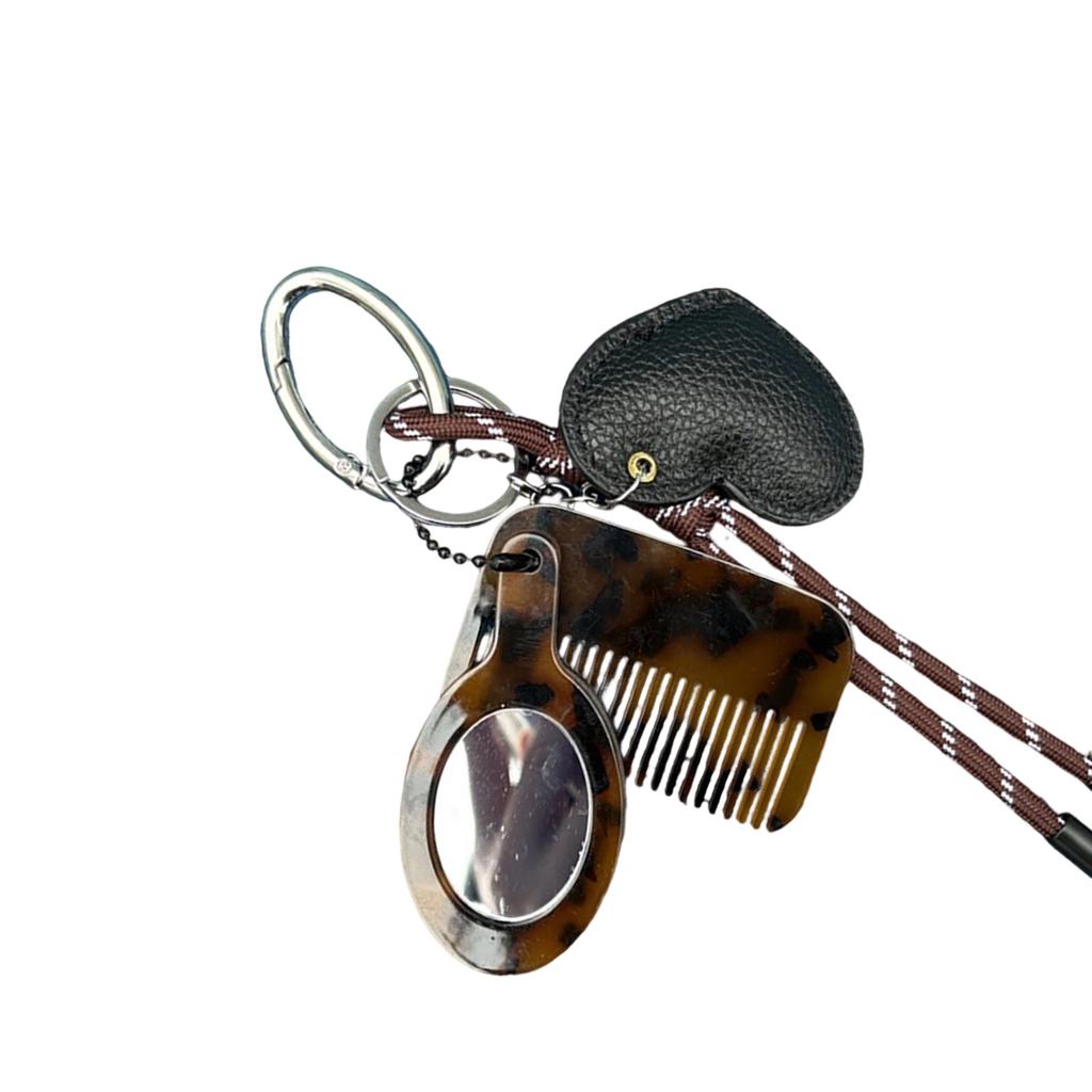 Kreative Designs Multifunktionaler Schlüsselanhänger Kamm Spiegel Tragbares Haarwerkzeug und Kosmetikzubehör für den täglichen Gebrauch