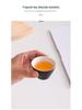 Portable Travel Tea Set: Teapot, Four Cups, and Storage Bag for Outdoor Camping.