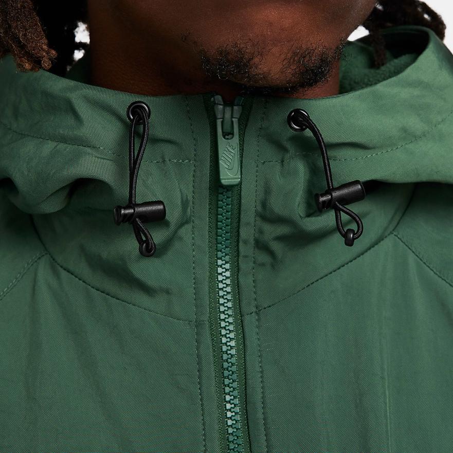 Nike Abbigliamento sportivo Windrunner Logo Ricamato Giacca con Cappuccio Casual Ampia Uomo giacche Verde FB8618-323