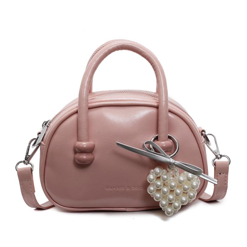 Korean version of the hot-selling cream style portable bowling bag, girls' fashion and advanced sense, foreign style versatile simple messenger bag