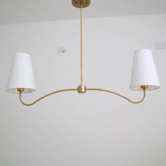 

Brass Elegance with Linen Shade: A Timeless Chandelier for Distinctive Spaces