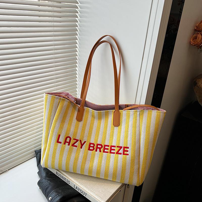 

Literary striped large-capacity bag women s 2025 new Korean version trendy underarm bag casual commuter portable tote bag 51*13*28 жёлтый